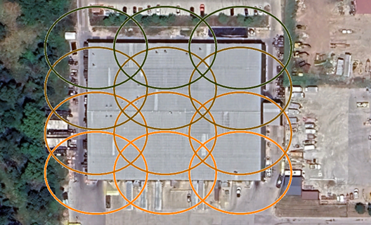 An aerial image of a building with overlapping circles to show the best photo map for model creation in iTwin Capture Modeler